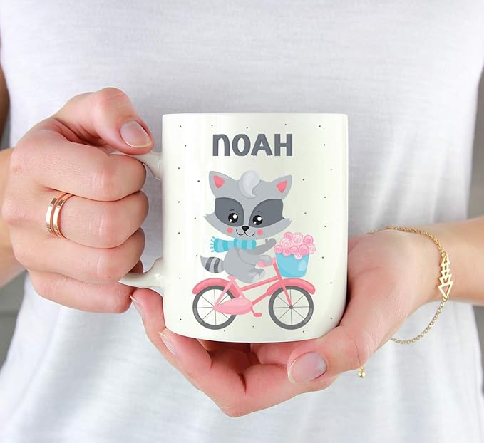 Andaz Press Personalized 11oz. Kids Milk Hot Chocolate Mug, Raccoon Pink Bicycle, 1-Pack, Custom Child’s Birthday Christmas Coffee Cup